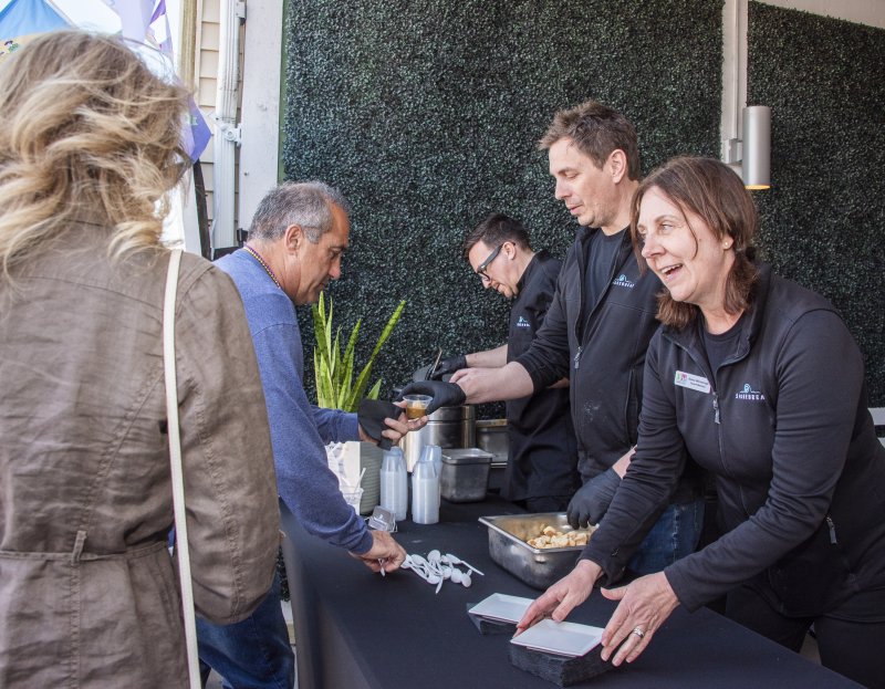 Shorebreak Executive Chef Michael Murty and owners Ben and Diane Winaczyk dish up their version of gumbo. It included a house-made biscuit and Louisiana andouille sausage.